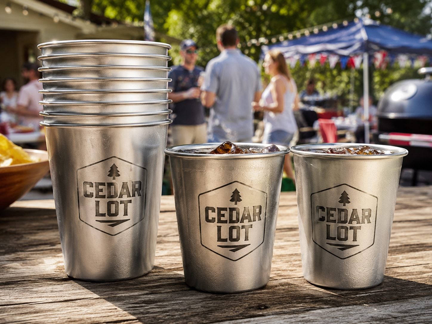 Wrap-printed recyclable aluminum cup for a stadium concourse with an invented event brand